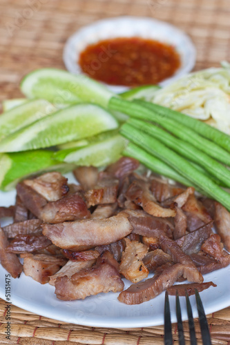 Closeup of grilled pork neck, Thai style gourmet food.