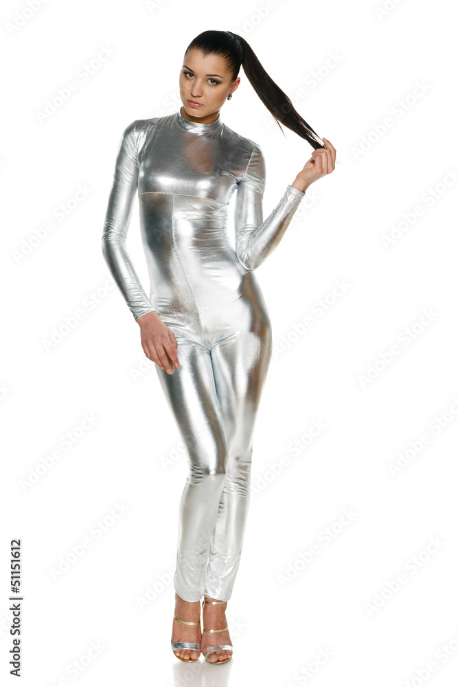 Futuristic young woman in silver clothing in full length