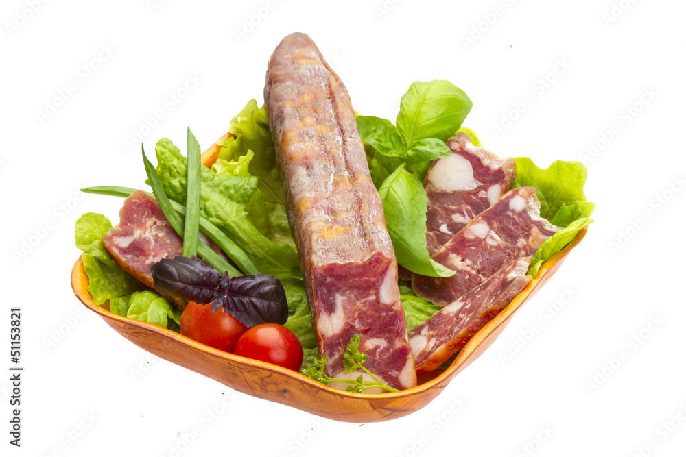 Ripe salami with salad, basil, onion and tomato Ripe salami with salad, basil, onion and tomato