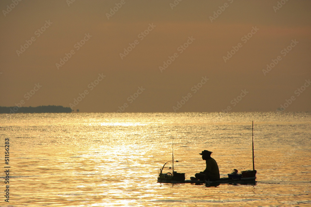 Silhouette of fisherman at sunrise, Gulf of Thailand, Cambodia