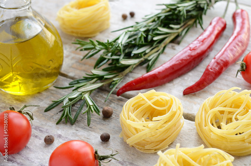 Raw tagliolini nest with tomatoes, rosemary, chilli and allspice