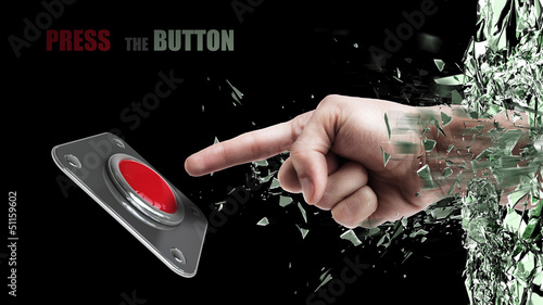Hand press on big Red button out of cracked glass isolated on black background