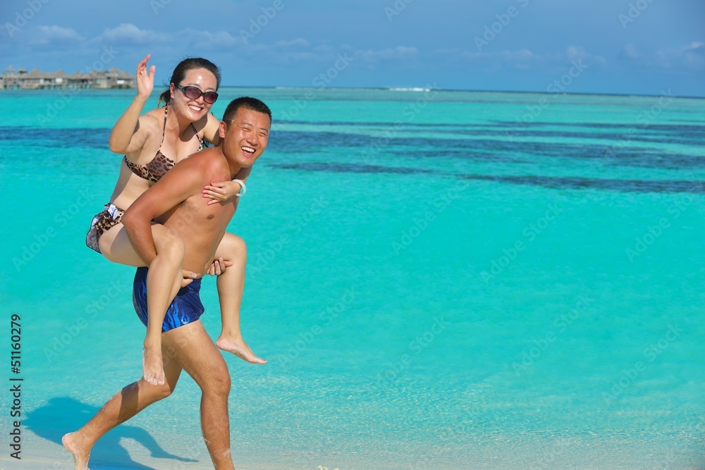 happy young couple enjoying summer on beach happy young couple enjoying summer on beach