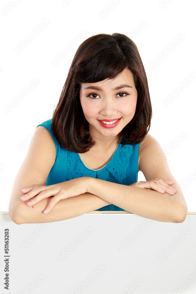 smiling young woman showing blank signboard smiling young woman showing blank signboard