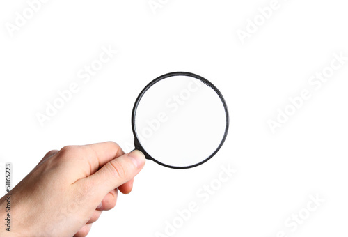 Hand holding a black magnifying glass isolated on white