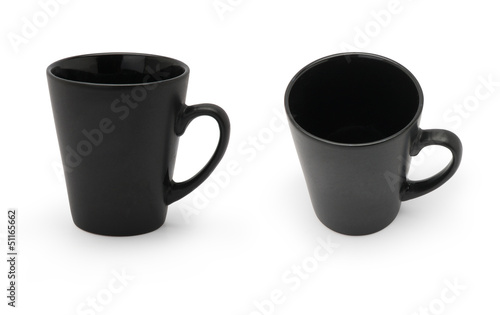 Two black mugs in different angles isolated on white