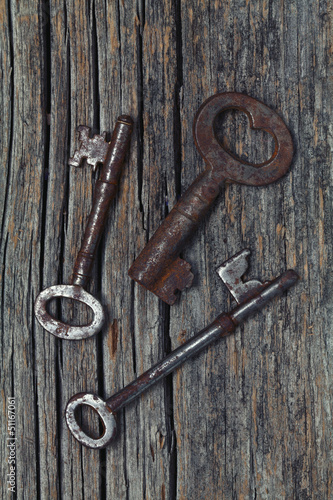 old rustic keys on wooden backround