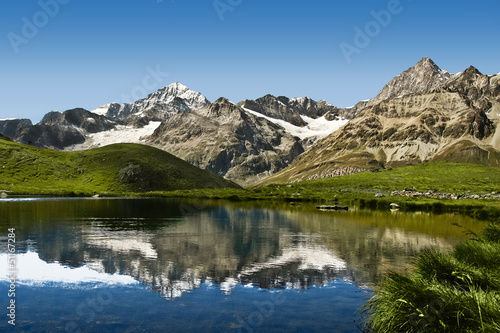 Fototapeta Naklejka Na Ścianę i Meble -  Amazing view of mountain lake in the Swiss Alps