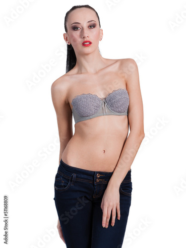 Beautiful sexy topless woman in blue jeans, isolated on white ba