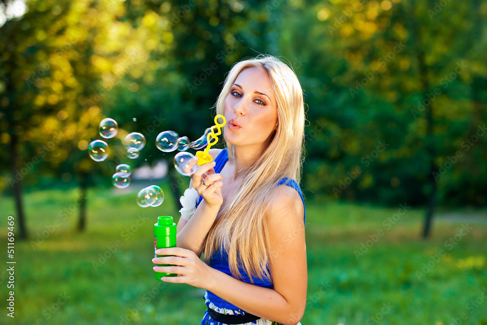 pretty blond girl blow soap bubbles outdoor pretty blond girl blow soap bubbles outdoor
