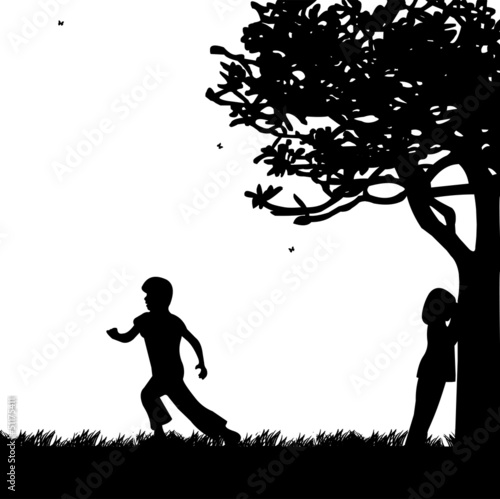 Children playing hide and seek in the park silhouette