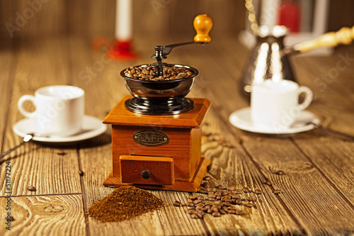 coffee grinder with coffee on the table