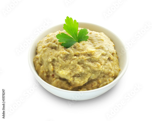 Aubergine paste in a bowl on white background