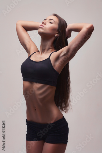 Woman performing exercises © Aleksandr Doodko