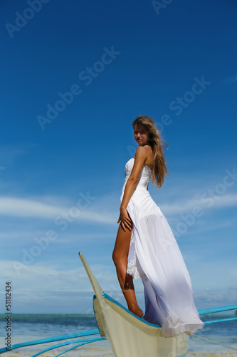 outdoor portrait of young beautiful woman bride in wedding dress