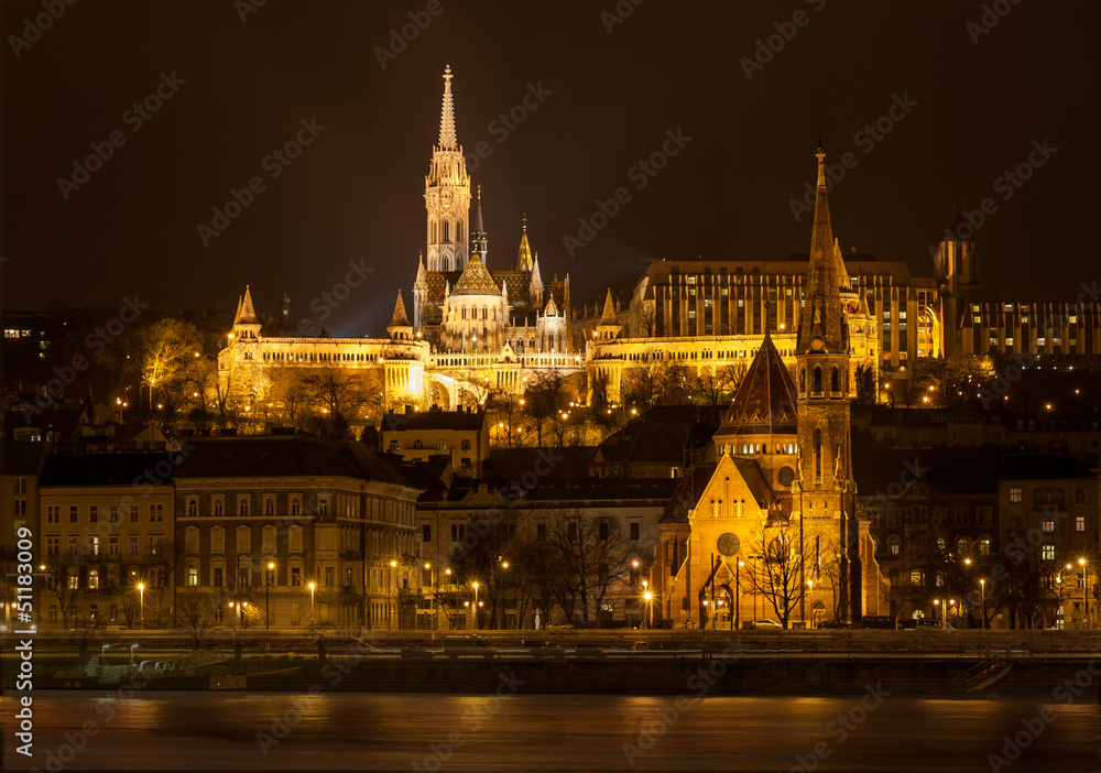 Matthias Church and Protestant church in Budapest at night