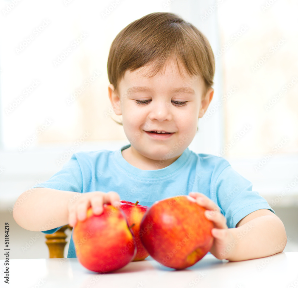 Portrait of a happy little boy with apples Portrait of a happy little boy with apples