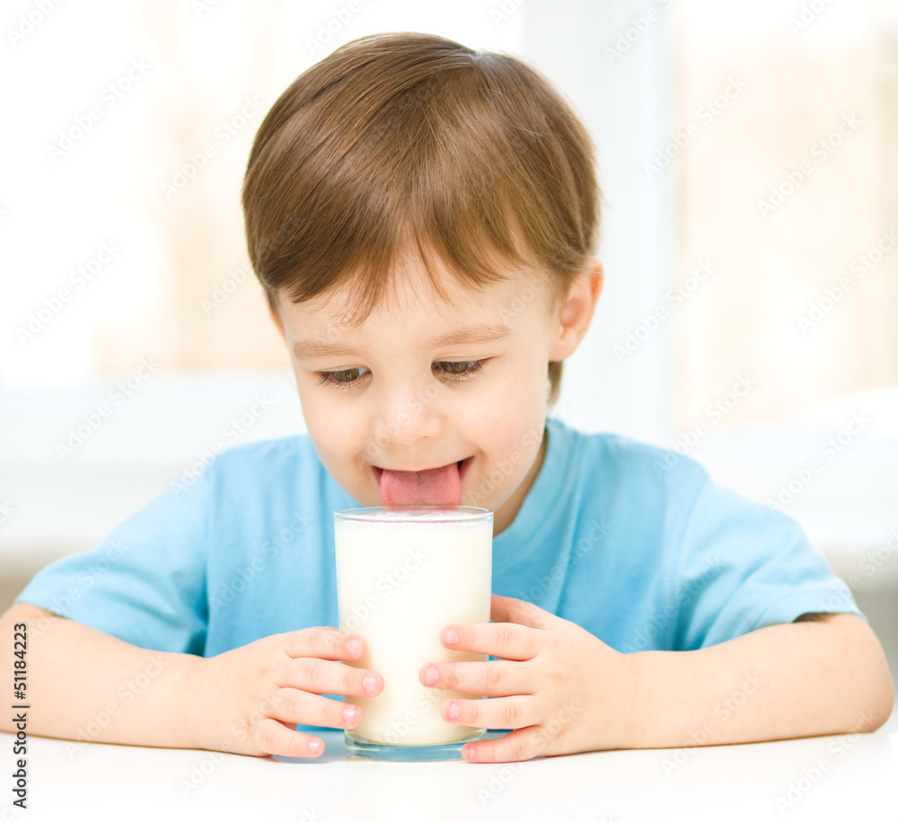 Cute little boy with a glass of milk Cute little boy with a glass of milk