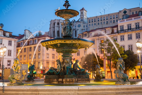 Baroque fountain in Rossio square at dusk, Lisboa, Portugal