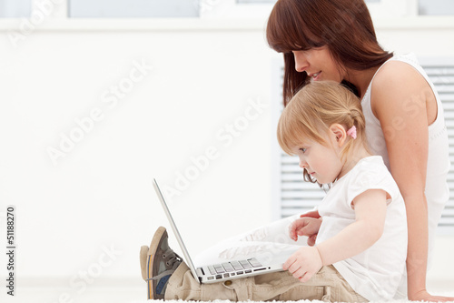 Loving family looking at a laptop