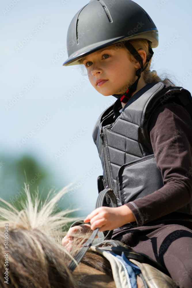 Horse riding - lovely girl is riding on a horse Horse riding - lovely girl is riding on a horse