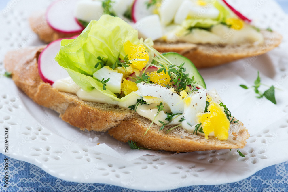 Sandwiches wit egg, lettuce, radish and cucumber Sandwiches wit egg, lettuce, radish and cucumber