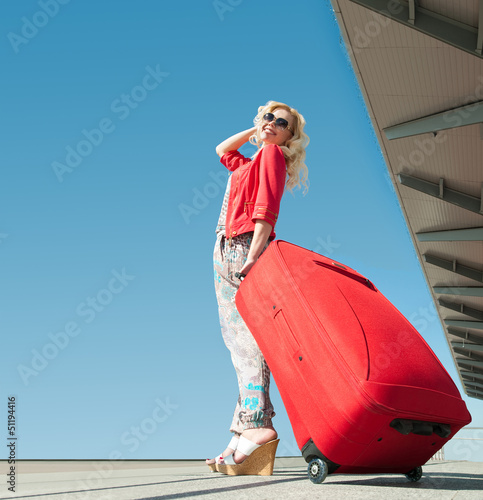 girl goes on vacation with suitcase