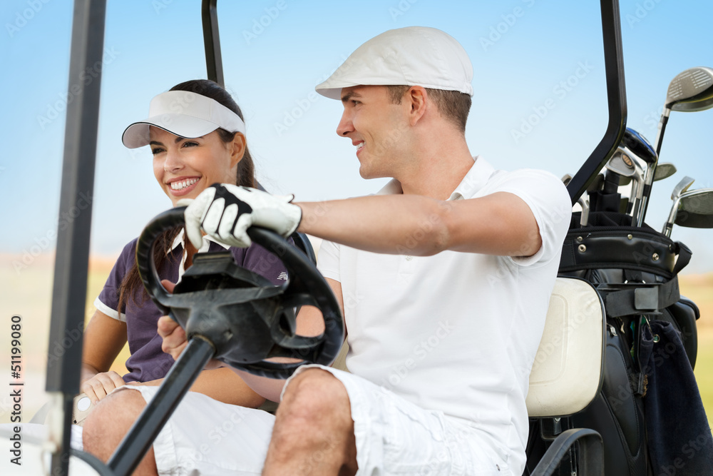 Happy young couple on golf course