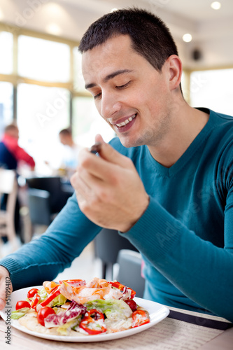 Young man eating