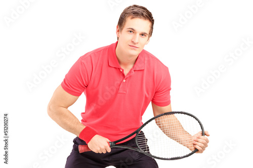 A male tennis player holding a racket