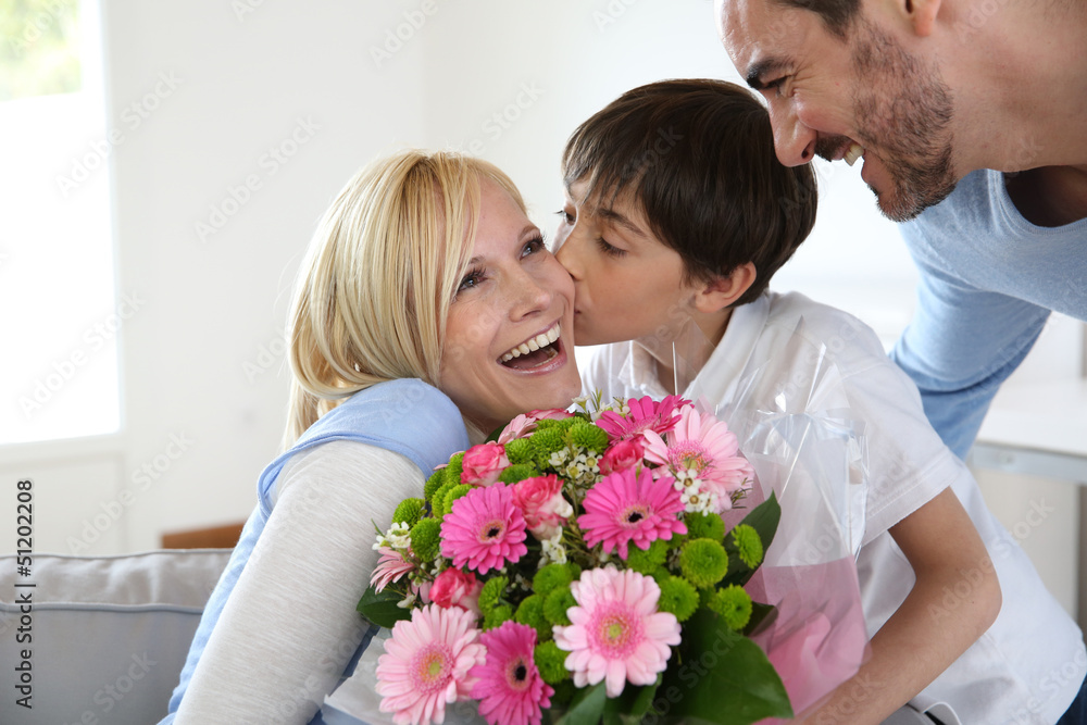 Young boy with father celebrating mother's day