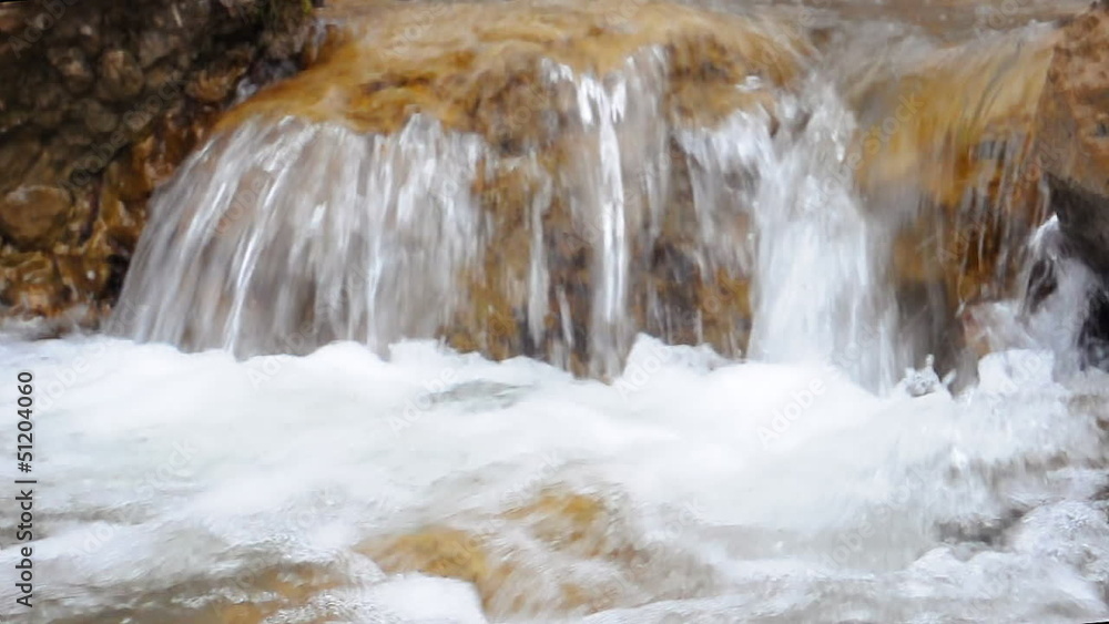 Beautiful mountain stream flowing through the green forest. Beautiful mountain stream flowing through the green forest.