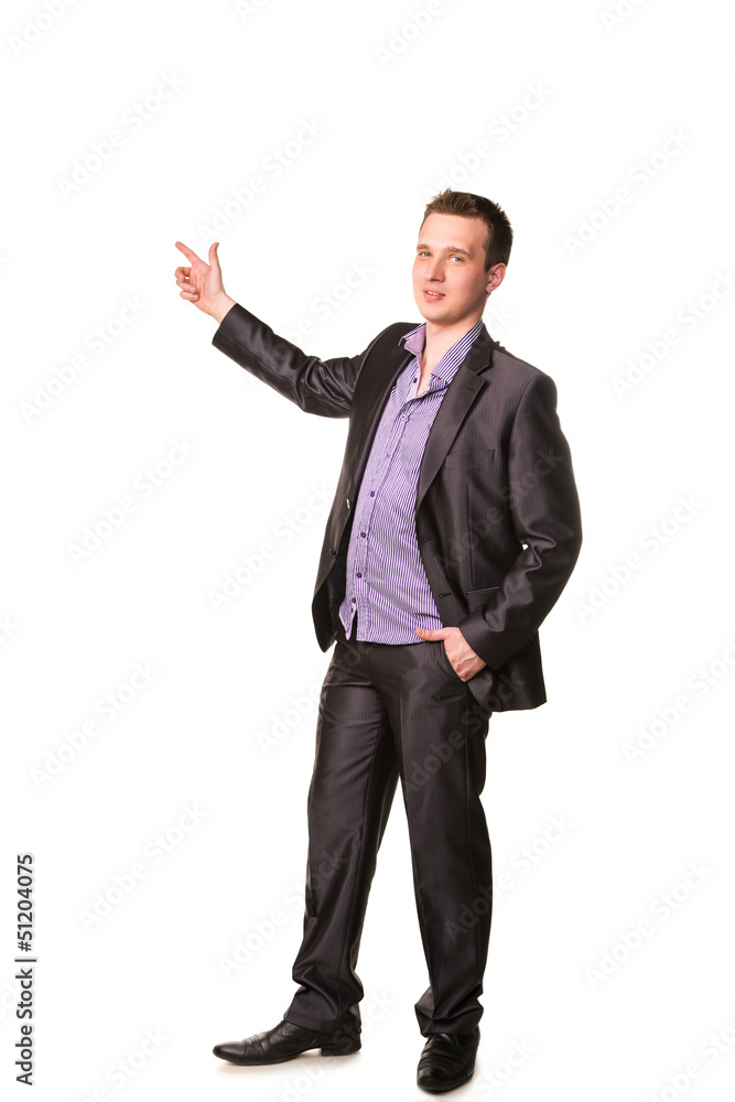 Happy young friendly smiling businessman pointing finger Happy young friendly smiling businessman pointing finger