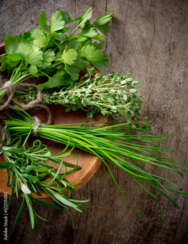 Fresh herbs on wooden table