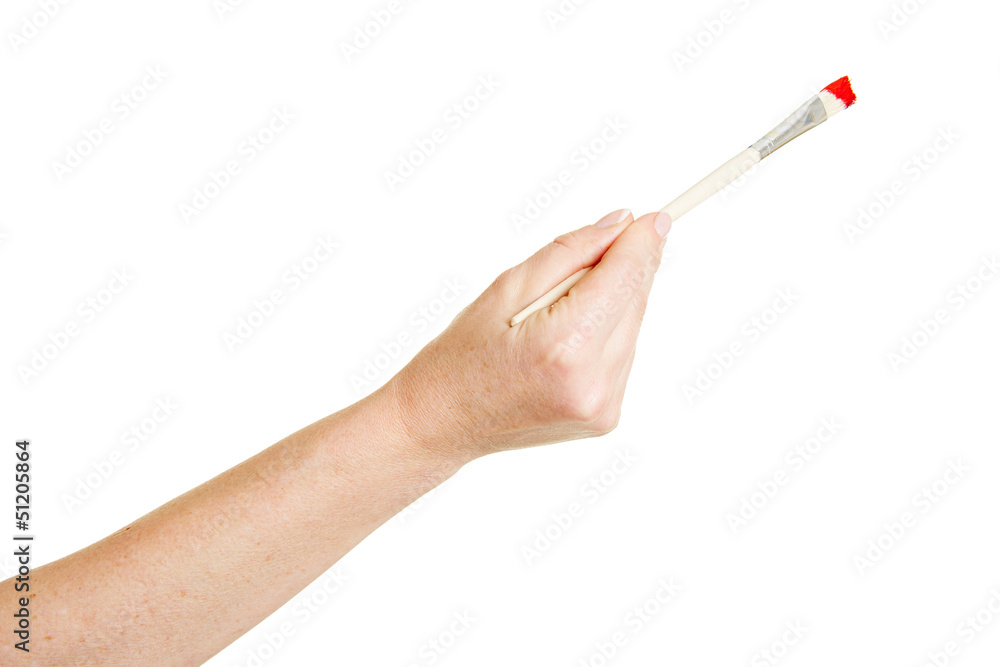 Hand malt mit Pinsel die Farbe rot Hand malt mit Pinsel die Farbe rot