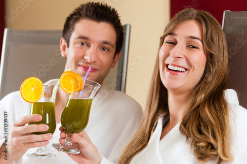 Wellness - Couple with Chlorophyll-Shake in Spa