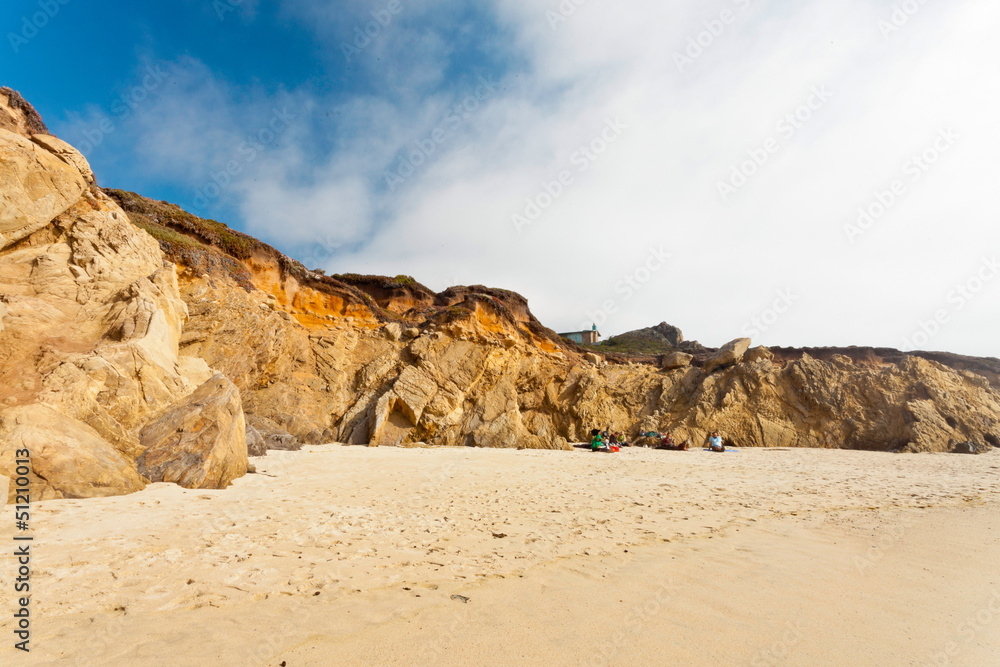 Beach with rocks. Cloudy sky. Big Sur. California. USA.