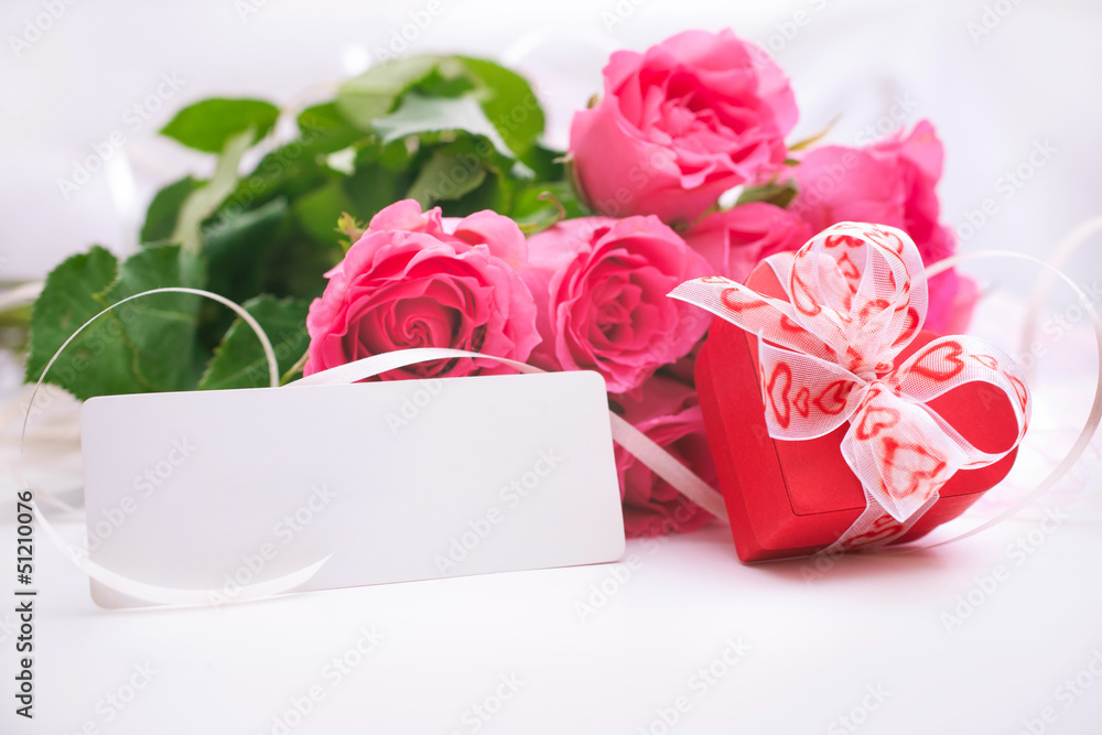 Roses and gift box with a card Roses and gift box with a card