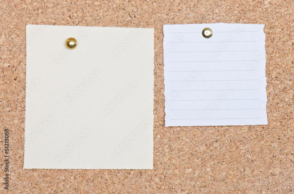 Two memo notes on a cork bulletin board Two memo notes on a cork bulletin board