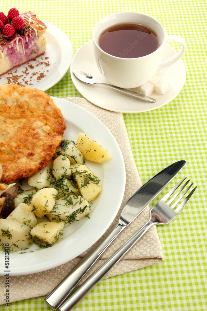 Roast chicken cutlet with boiled potatoes and  vegetables, cup