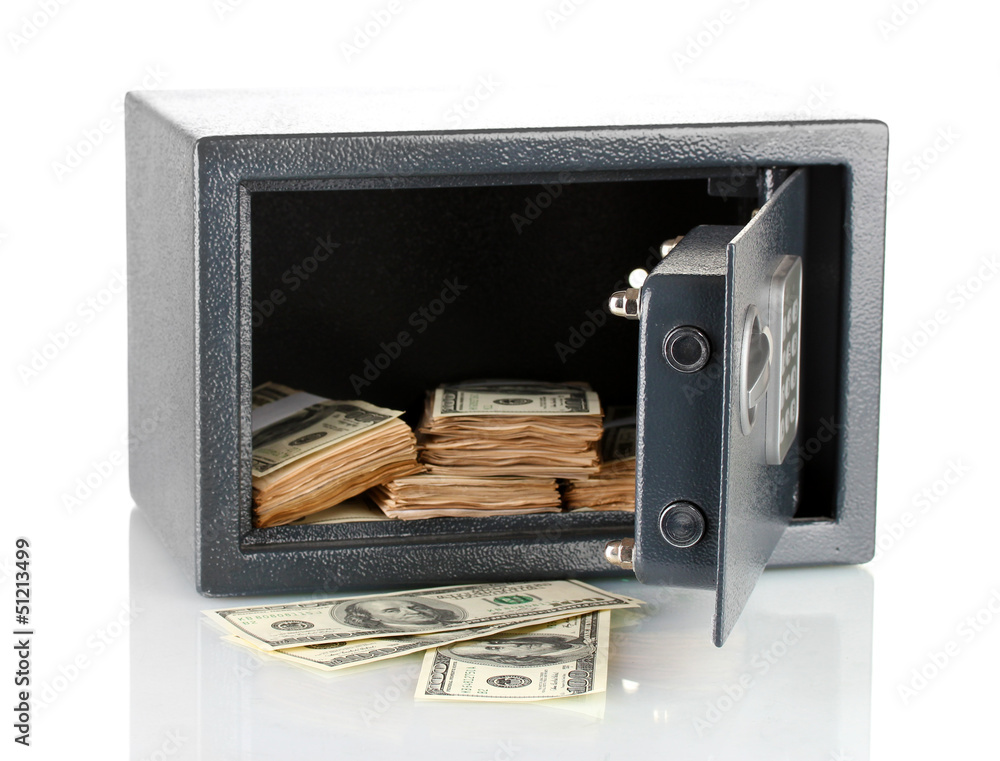 Naklejka premium Money in open safe isolated on white