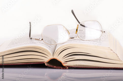 old book with glasses