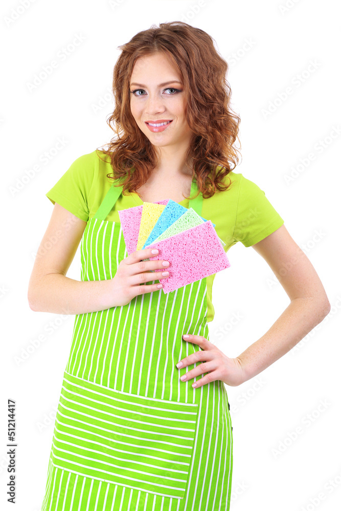 Young woman wearing green apron with cleaning sponges, isolated Young woman wearing green apron with cleaning sponges, isolated