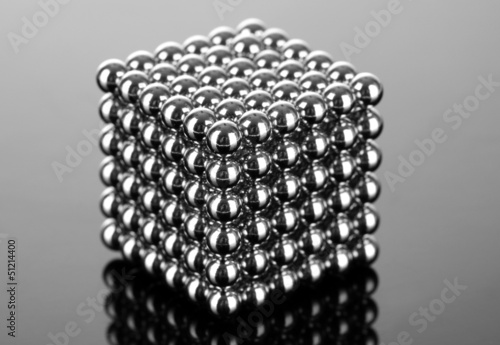 Fotografie Neocube (toy) on dark grey background
