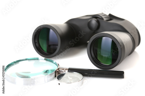 Black modern binoculars with magnifying glass and compass