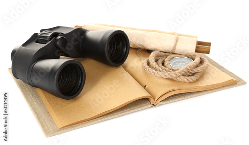 Black modern binoculars with old notebook isolated on white
