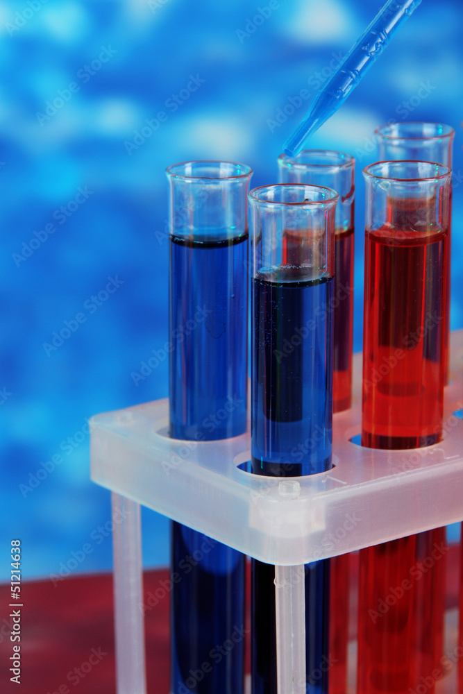 Blue and red test tubes close-up Blue and red test tubes close-up