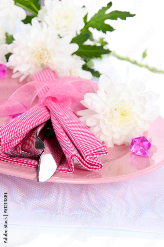 Served plate with napkin and flowers close-up Served plate with napkin and flowers close-up