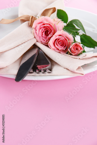 Served plate with napkin and rose close-up