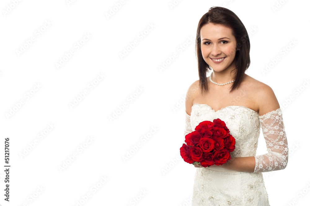 Pretty bride posing with love red roses bouquet Pretty bride posing with love red roses bouquet